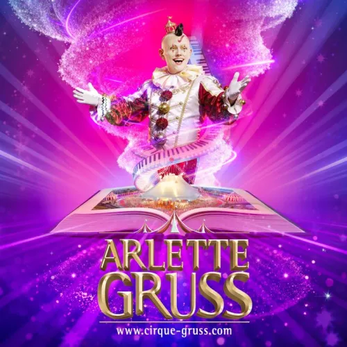 Arlette Gruss circus poster featuring a colorful clown emerging from an open magic book, surrounded by pink and purple light effects, with the circus logo and website displayed at the bottom.