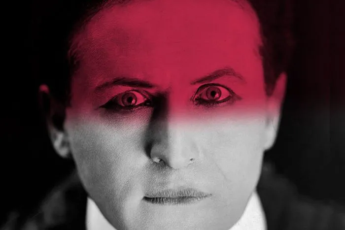 Stylized portrait of a man in formal attire with dramatic pink lighting, inspired by the Macbeth opera at Bordeaux