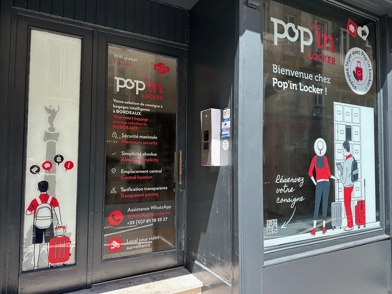 Storefront of Pop'in Locker intelligent luggage storage service in Bordeaux, displaying key features (free wifi, maximum security, simplicity, central location, transparent pricing) with illustration of travelers with luggage