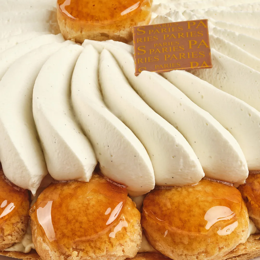 Pastries from Maison Pariès in Bordeaux: golden tarts with ganache and slices of fresh white cheese with house label