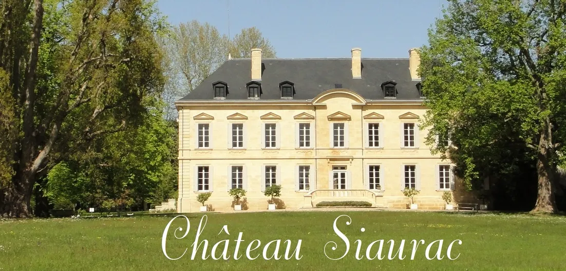 Château Siaurac, an elegant 18th-century Bordeaux mansion featuring a cream-colored façade, mansard roof, and tree-lined grounds