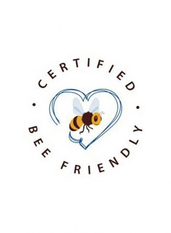 Certified Bee Friendly logo featuring a stylized bee in the center of a blue heart with circular text