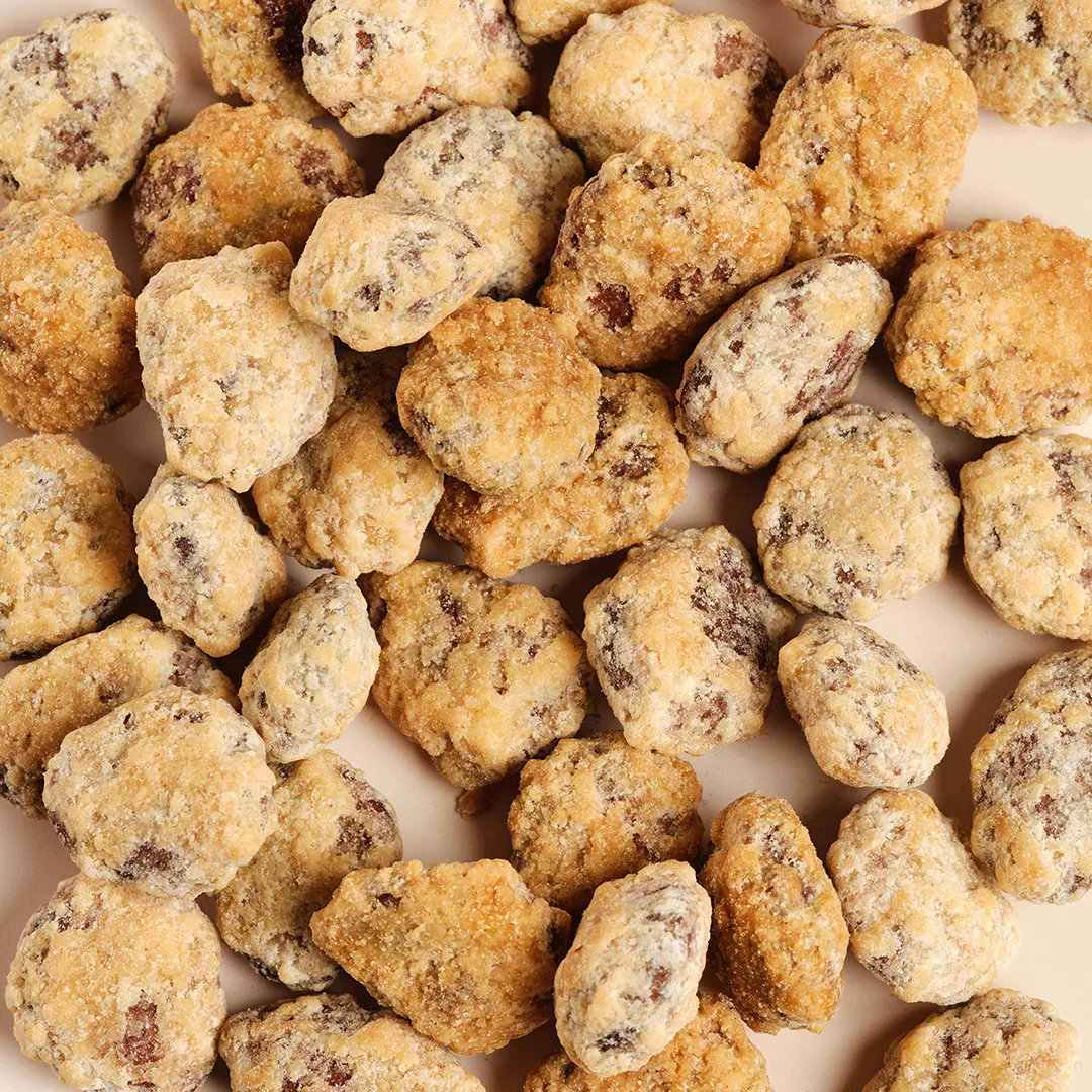 Chocolate chip shortbread cookies from Maison Pariès in Bordeaux, arranged on a white background.