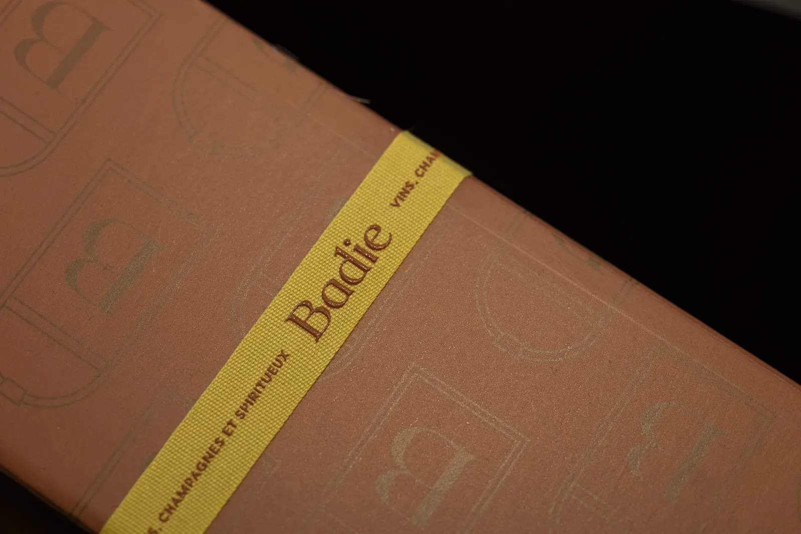 Brown bound book with yellow bookmark inscribed 'Bordeaux' and 'Chamborant Ensemble Boodie', on black background