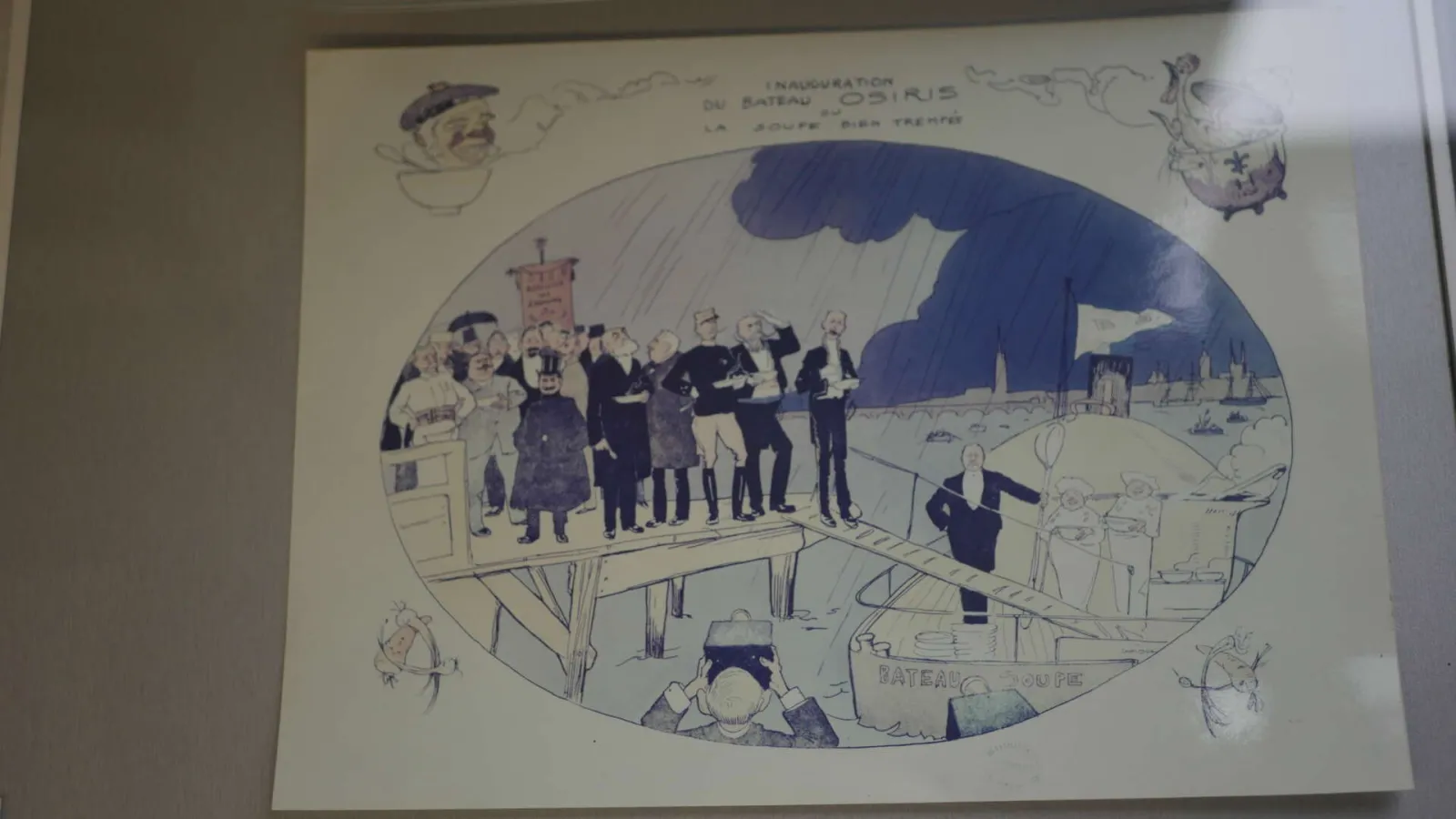 Satirical illustration depicting the inauguration of a riverboat in Bordeaux, featuring official dignitaries on a viewing platform overlooking the Garonne river with the city skyline in the background and humorous marginal details.