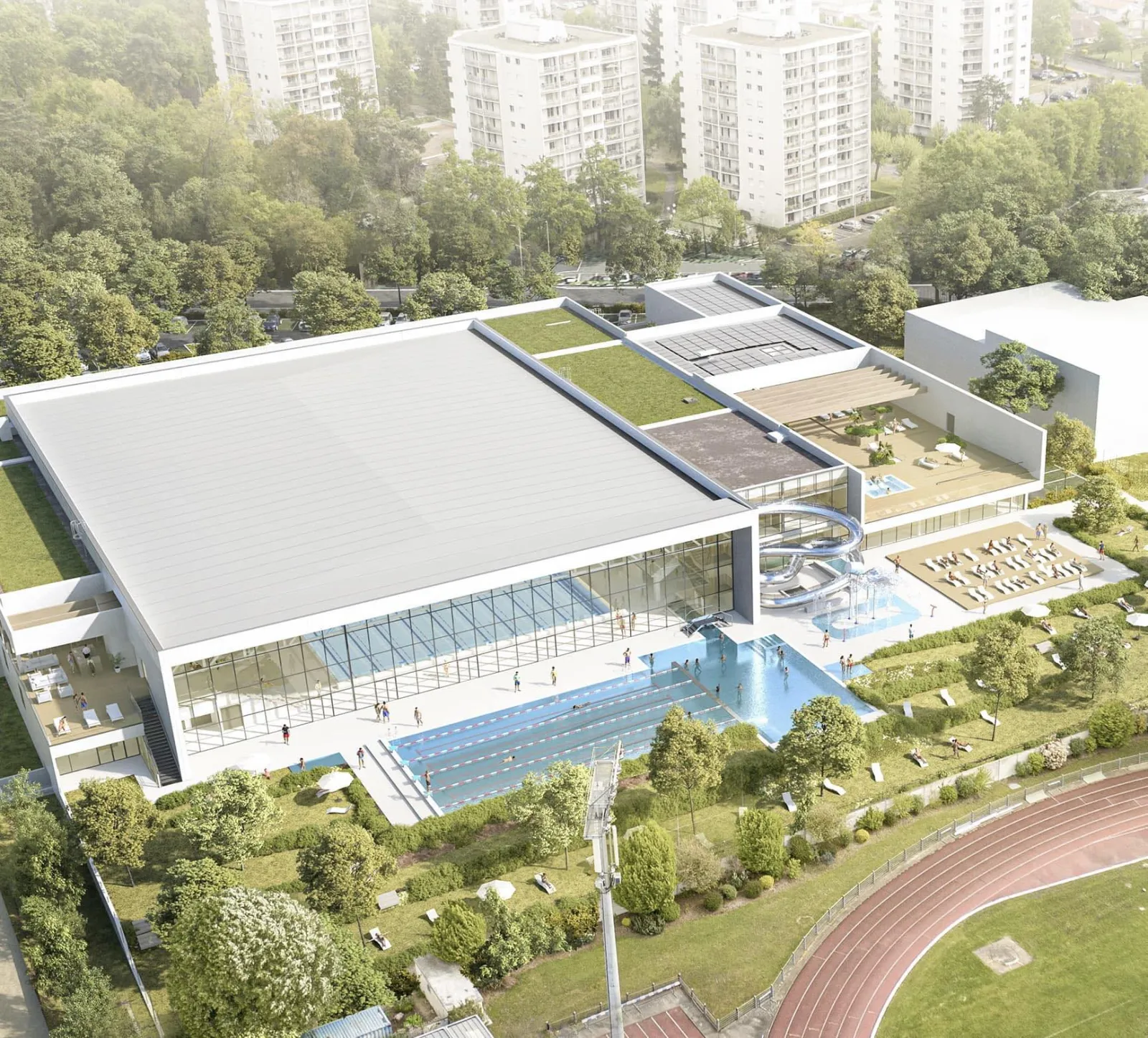Aerial view of the UCPA Aqua Stadium complex in Mérignac near Bordeaux, featuring a covered Olympic swimming pool, relaxation areas, green spaces, and modern sports facilities surrounded by residential buildings.