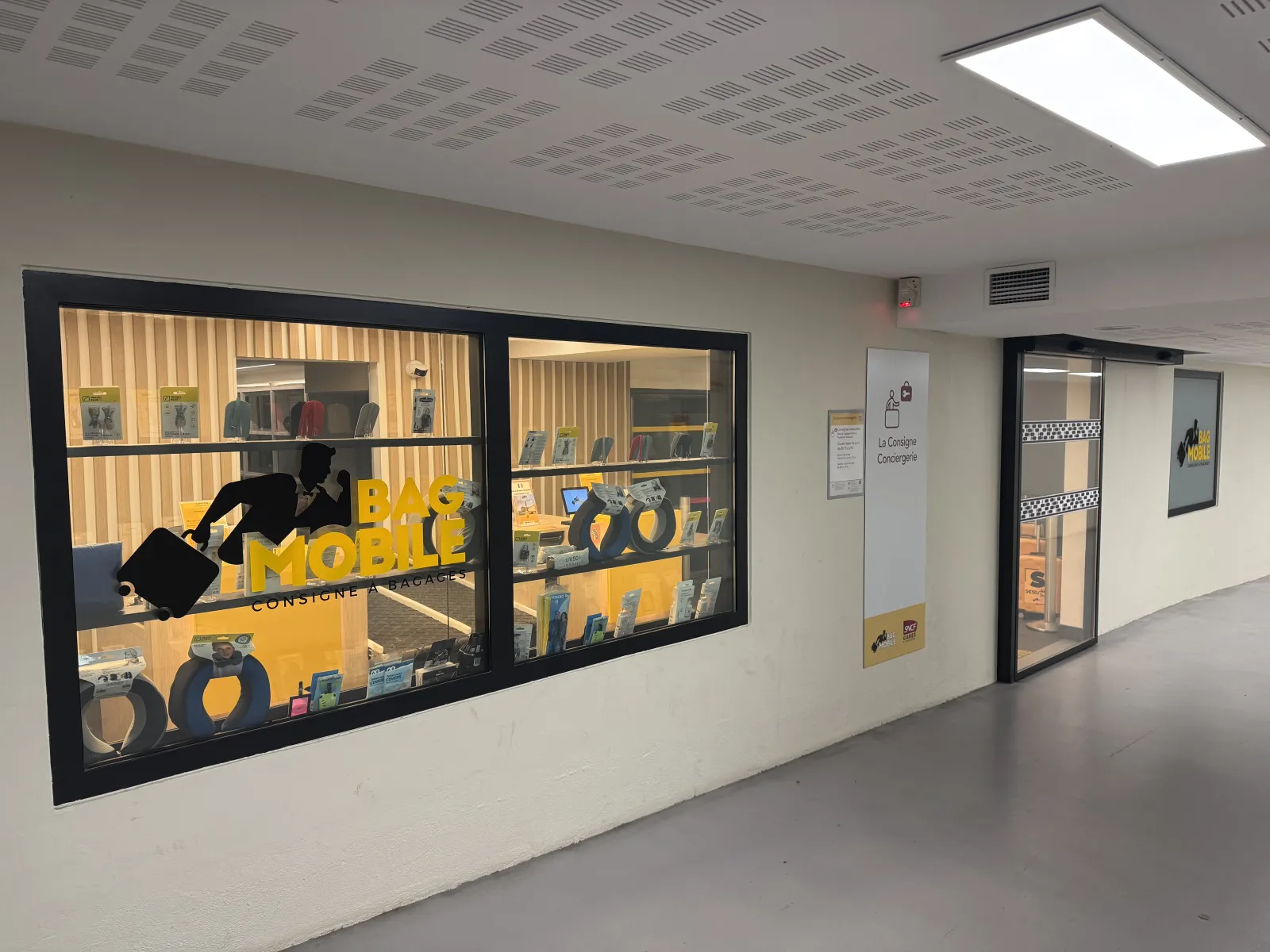 Bag Mobile store frontage in Bordeaux displaying backpacks and accessories in window display with yellow and black signage and glass entrance door