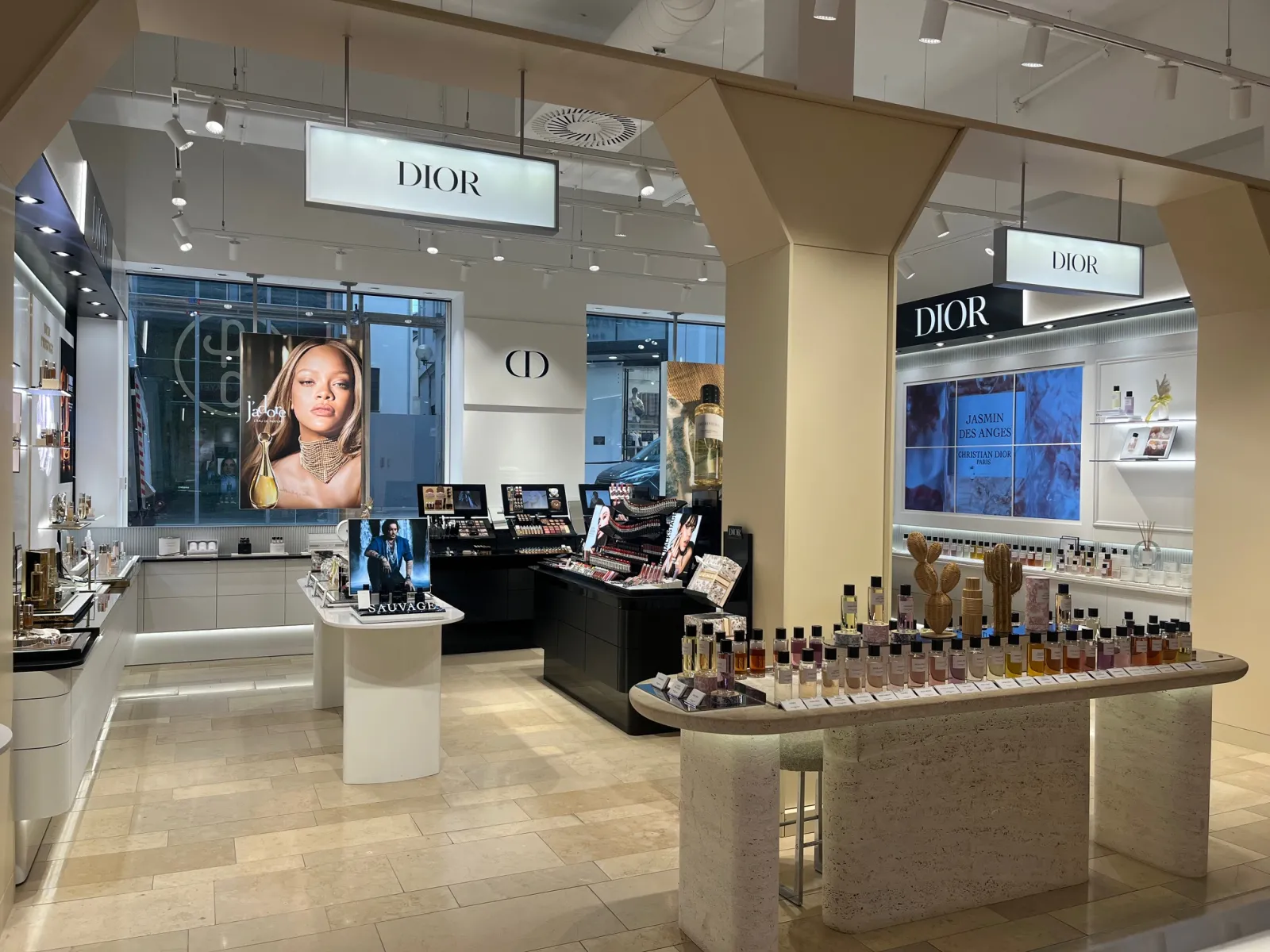 Dior luxury boutique at Galeries Lafayette in Bordeaux featuring cosmetics, fragrances and beauty products with advertising displays and retail counters.