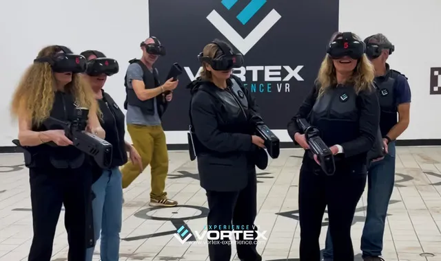 Group of people wearing VR headsets at Vortex Experience venue in Bordeaux, participating in an interactive virtual reality experience.