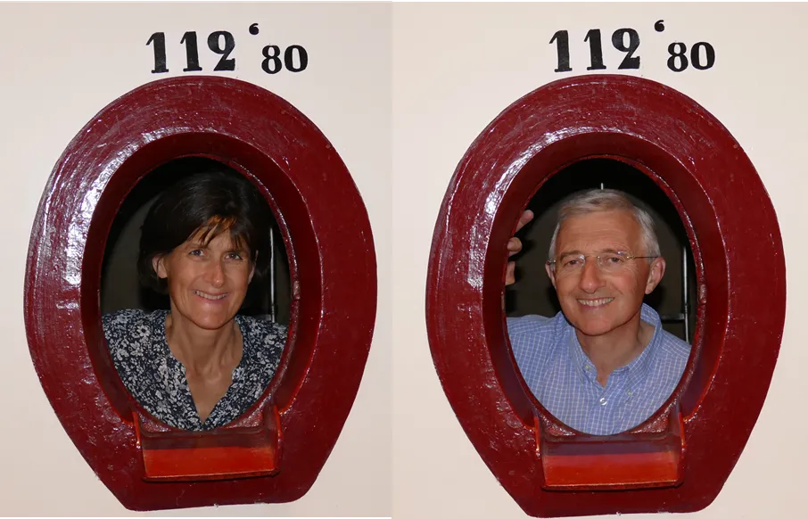 Two portrait photographs of a woman and a man framed in numbered red oval frames (112°80), displayed at Château Laniote in Bordeaux.