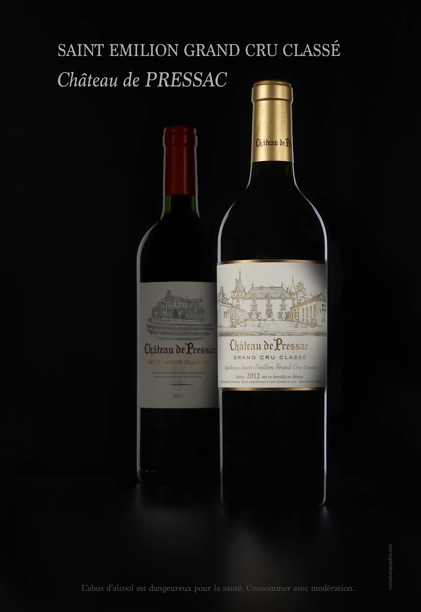 Two bottles of Saint-Émilion Grand Cru Classé red wine from Château de Pressac displayed against a black background, showing visible labels and gold capsule.
