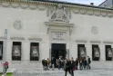Facade of the Bordeaux Museum of Fine Arts, neoclassical white building with columns and sculptural medallions, main entrance with visitors outside